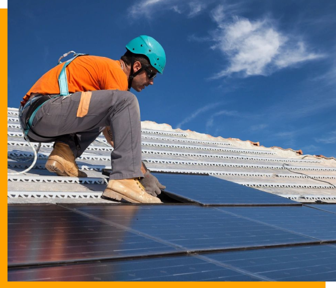 A man working on the roof of a building.